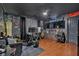 Finished basement with hardwood floors, a home office setup, and a cool, industrial-themed design at 138 Lakestone Pkwy, Woodstock, GA 30188