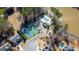 Aerial shot of community amenities, including tennis courts and a pool, providing recreational opportunities at 138 Lakestone Pkwy, Woodstock, GA 30188
