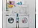 A well-organized laundry room with two modern washing machines and plenty of storage space at 138 Lakestone Pkwy, Woodstock, GA 30188