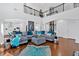 Spacious living room with a high ceiling, open floor plan, and modern décor, perfect for entertaining at 138 Lakestone Pkwy, Woodstock, GA 30188