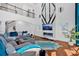 Spacious living room with high ceilings, a fireplace, and modern design elements at 138 Lakestone Pkwy, Woodstock, GA 30188