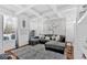 Comfortable living room with coffered ceilings and a decorative elephant wall hanging for a unique and cozy atmosphere at 138 Lakestone Pkwy, Woodstock, GA 30188