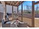Inviting screened porch with hanging chair, wicker furniture, and outdoor living space at 138 Lakestone Pkwy, Woodstock, GA 30188