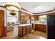 Kitchen featuring wood cabinets, center island and view to the living room at 3241 Sewell Mill Rd, Marietta, GA 30062