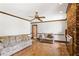 Comfortable living room with brick fireplace and classic ceiling fan at 3241 Sewell Mill Rd, Marietta, GA 30062