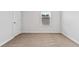 Empty bedroom with carpet floors and a large window at 654 Egrets Lndg, Covington, GA 30014