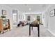 Spacious game room with foosball table, cozy seating area and plenty of natural light at 654 Egrets Lndg, Covington, GA 30014