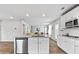 Modern kitchen with granite countertops, stainless steel appliances, and wood flooring at 654 Egrets Lndg, Covington, GA 30014