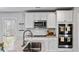 Kitchen features a large island, stainless steel appliances, and granite countertops at 654 Egrets Lndg, Covington, GA 30014