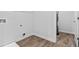 An empty laundry room with lots of space for storage at 654 Egrets Lndg, Covington, GA 30014