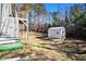 Well maintained backyard with a utility shed for all your storage needs, nestled on a wooded lot at 7865 Lake Ter, Douglasville, GA 30134