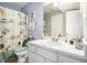Fresh bathroom with a white vanity, and a shower with a seashell-themed curtain at 7865 Lake Ter, Douglasville, GA 30134