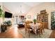 Open-concept dining area with a vaulted ceiling and nice natural light from windows and a door at 7865 Lake Ter, Douglasville, GA 30134