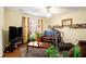Comfortable living room with a ceiling fan, natural light, and hardwood flooring at 7865 Lake Ter, Douglasville, GA 30134