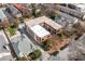The building is surrounded by residences, mature trees and greenery in this aerial view of the neighborhood at 1026 Saint Charles Ne Ave # 10, Atlanta, GA 30306