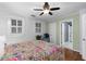 Bedroom with hardwood floors and access to laundry closet with stacked washer/dryer at 1026 Saint Charles Ne Ave # 10, Atlanta, GA 30306