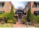 Charming brick building entrance with elegant landscaping and covered entryway at 1026 Saint Charles Ne Ave # 10, Atlanta, GA 30306
