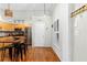Well-lit kitchen featuring wooden cabinets, stainless steel appliances, and counter seating at 1026 Saint Charles Ne Ave # 10, Atlanta, GA 30306