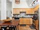 Modern kitchen with stainless steel appliances and wooden cabinetry at 1026 Saint Charles Ne Ave # 10, Atlanta, GA 30306