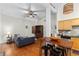 Open concept living room with hardwood floors, and combined kitchen at 1026 Saint Charles Ne Ave # 10, Atlanta, GA 30306