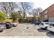 Exterior view of the apartment complex parking lot with available spots for residents and visitors at 1026 Saint Charles Ne Ave # 10, Atlanta, GA 30306
