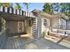 Spacious back porch features a striped awning, string lights, and an outdoor seating area at 1031 Lindridge Ne Dr, Atlanta, GA 30324