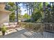 Back porch features wooden deck with a seating area overlooking a lush backyard at 1031 Lindridge Ne Dr, Atlanta, GA 30324