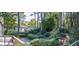 Backyard view from deck shows lush landscaping and neighboring houses at 1031 Lindridge Ne Dr, Atlanta, GA 30324