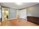 Bright bedroom with hardwood floors and a view of the closet and en-suite bathroom at 1031 Lindridge Ne Dr, Atlanta, GA 30324