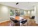 Bright dining area featuring hardwood floors, modern light fixture and multiple windows at 1031 Lindridge Ne Dr, Atlanta, GA 30324