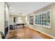 Open dining area with hardwood floors, a modern light fixture and large windows at 1031 Lindridge Ne Dr, Atlanta, GA 30324