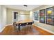 Stylish dining area with hardwood floors, modern art, and sleek black lighting fixture at 1031 Lindridge Ne Dr, Atlanta, GA 30324