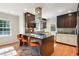 Modern kitchen with stainless steel appliances, island cooktop, and stylish cabinetry at 1031 Lindridge Ne Dr, Atlanta, GA 30324