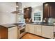 Modern kitchen featuring stainless steel appliances, dark cabinetry, and tiled backsplash at 1031 Lindridge Ne Dr, Atlanta, GA 30324