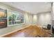 Bright living room featuring large windows and hardwood floors with modern art on the walls at 1031 Lindridge Ne Dr, Atlanta, GA 30324