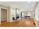 Inviting living room featuring hardwood floors, a modern fireplace, and ample natural light at 1031 Lindridge Ne Dr, Atlanta, GA 30324