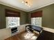 Cozy home office with natural light, modern decor, and ample desk space at 1031 Lindridge Ne Dr, Atlanta, GA 30324