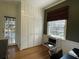 Well-lit home office featuring a closet, desk space, and neutral color palette at 1031 Lindridge Ne Dr, Atlanta, GA 30324