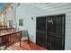 Backyard deck with secure metal door, perfect for grilling, relaxing, and storage at 1290 Adcox Sq, Stone Mountain, GA 30088