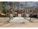Inviting townhome exterior featuring a well-manicured lawn and private driveways at 1290 Adcox Sq, Stone Mountain, GA 30088