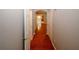 Hallway with wood flooring, light gray walls, and white doors at 1290 Adcox Sq, Stone Mountain, GA 30088