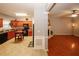 Charming kitchen next to living room with wood cabinets and black appliances at 1290 Adcox Sq, Stone Mountain, GA 30088