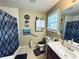 Functional bathroom featuring a shower-tub combination, practical storage, and neutral-toned walls at 33 Bo Xing, Temple, GA 30179