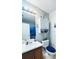 Clean bathroom featuring a vanity with a sink, toilet, and shower with a decorative curtain at 33 Bo Xing, Temple, GA 30179