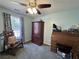 Comfortable bedroom with a ceiling fan and natural light coming in from the window at 33 Bo Xing, Temple, GA 30179