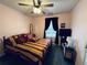 Cozy bedroom with striped bedding, a ceiling fan, and natural light from the window at 33 Bo Xing, Temple, GA 30179