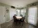 Bright dining area with a round table and natural light from the adjacent exterior door at 33 Bo Xing, Temple, GA 30179