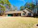 Charming single-story home with a well-maintained lawn and attached two-car garage at 33 Bo Xing, Temple, GA 30179