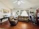 Comfortable living room with laminate wood flooring, ceiling fan, and natural light at 33 Bo Xing, Temple, GA 30179