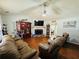 Cozy living room featuring a fireplace, ceiling fan, and laminate wood flooring at 33 Bo Xing, Temple, GA 30179